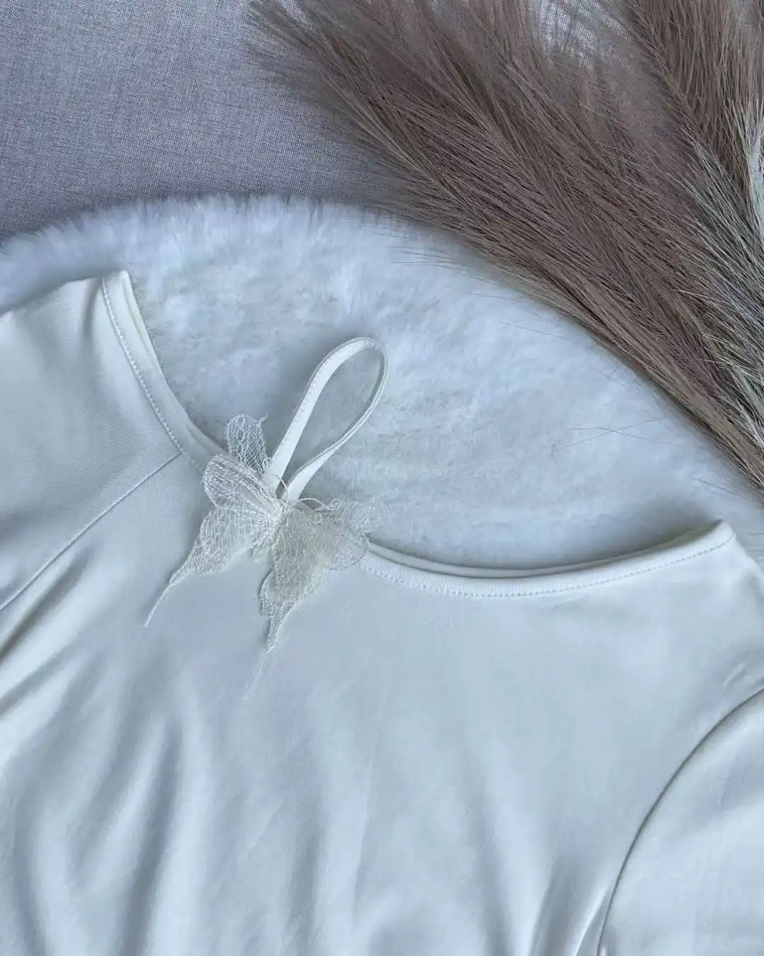 Product image of Butterfly Detail Asymmetric Ruffle Hem Ruched Tee