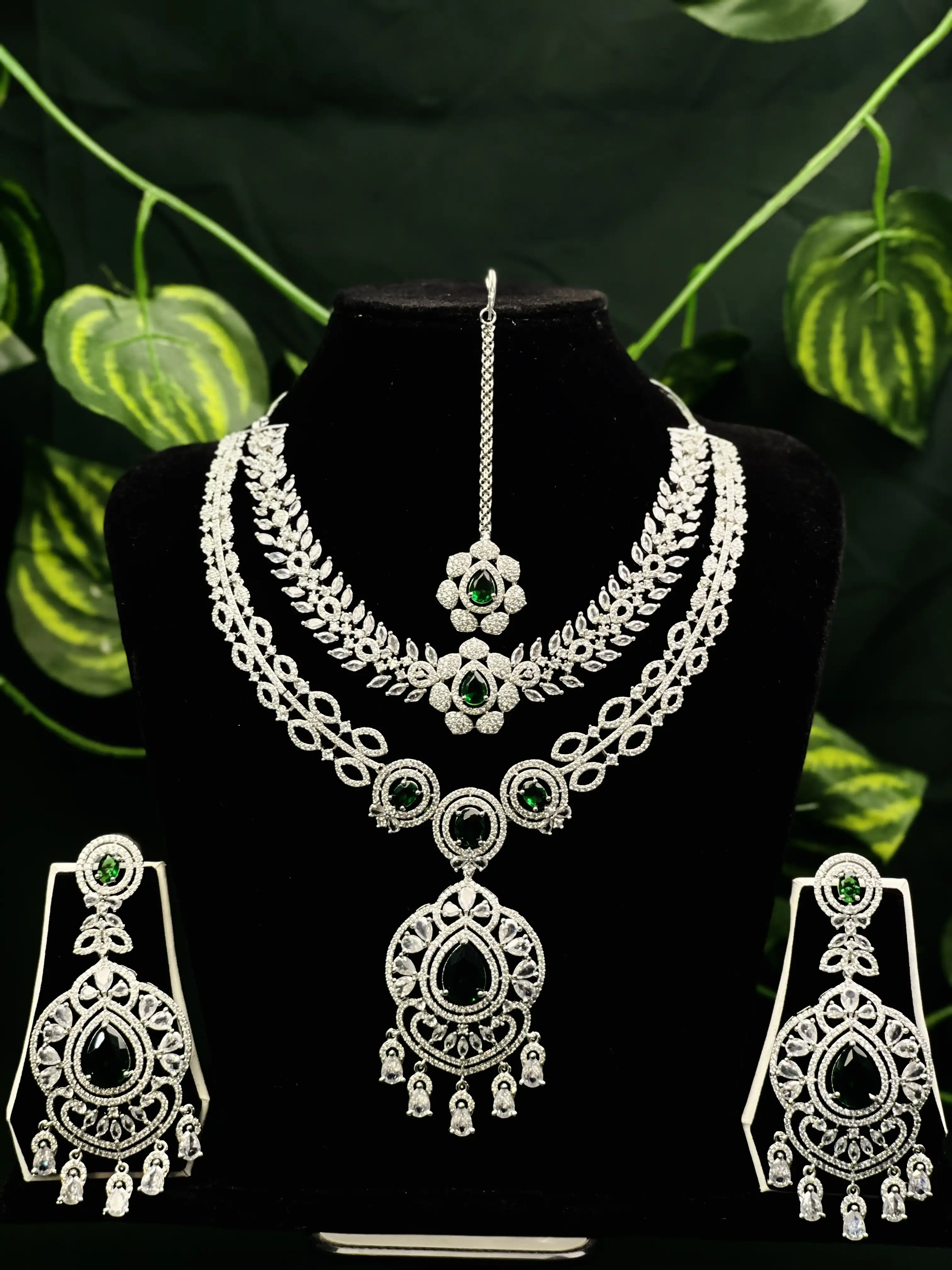 Product image of ADN3110 | Grand American Diamond & Emerald Green Multi-Layered Jewelry Set (Necklace, Earrings, Maang Tikka)