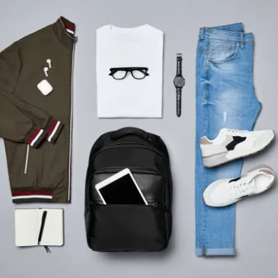 Fat lay of  travelers clothes a...