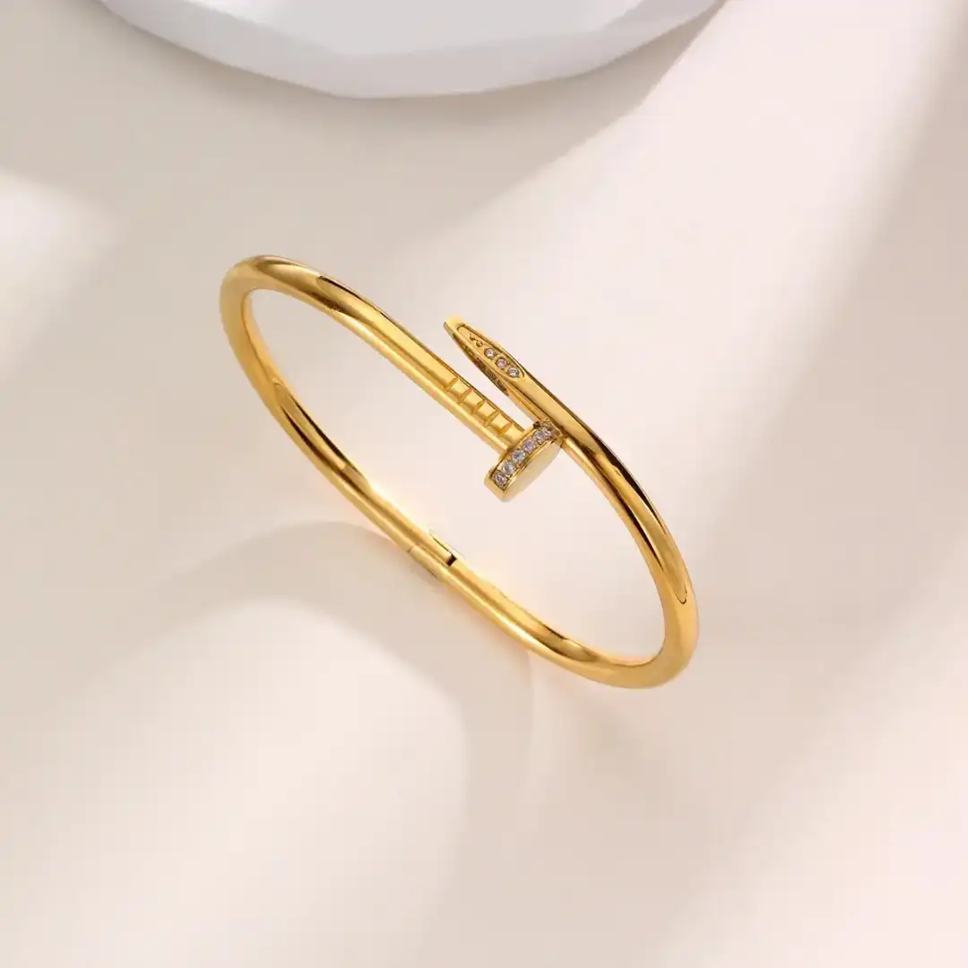 Product image of ZENOURA 18K GOLD PLATED SEMI STUDDED CARTIER NAIL BRACELET BANGLE
