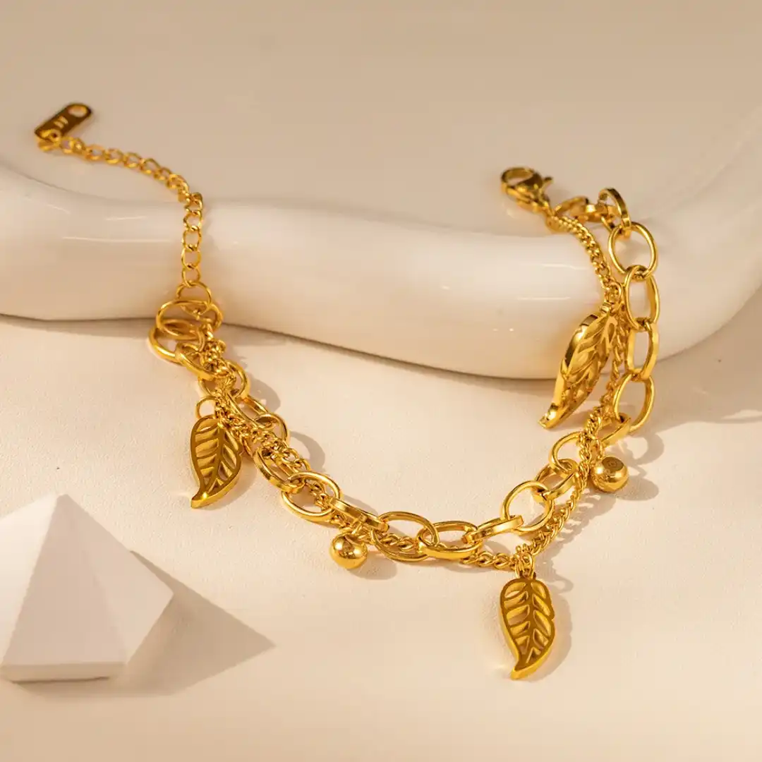Product image of ZENOURA 18K GOLD PLATED AURORA LEAF CHARM BRACELET