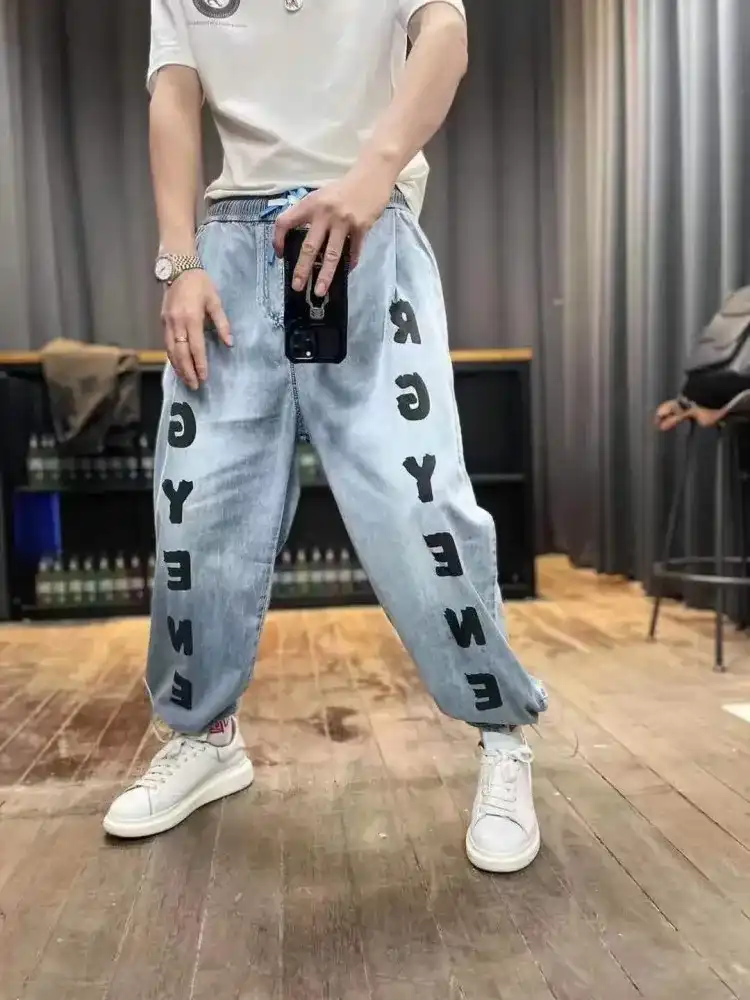 Product image of S1019 Letter Printed Adjustable Straight Baggy Jeans Track " Light Blue "