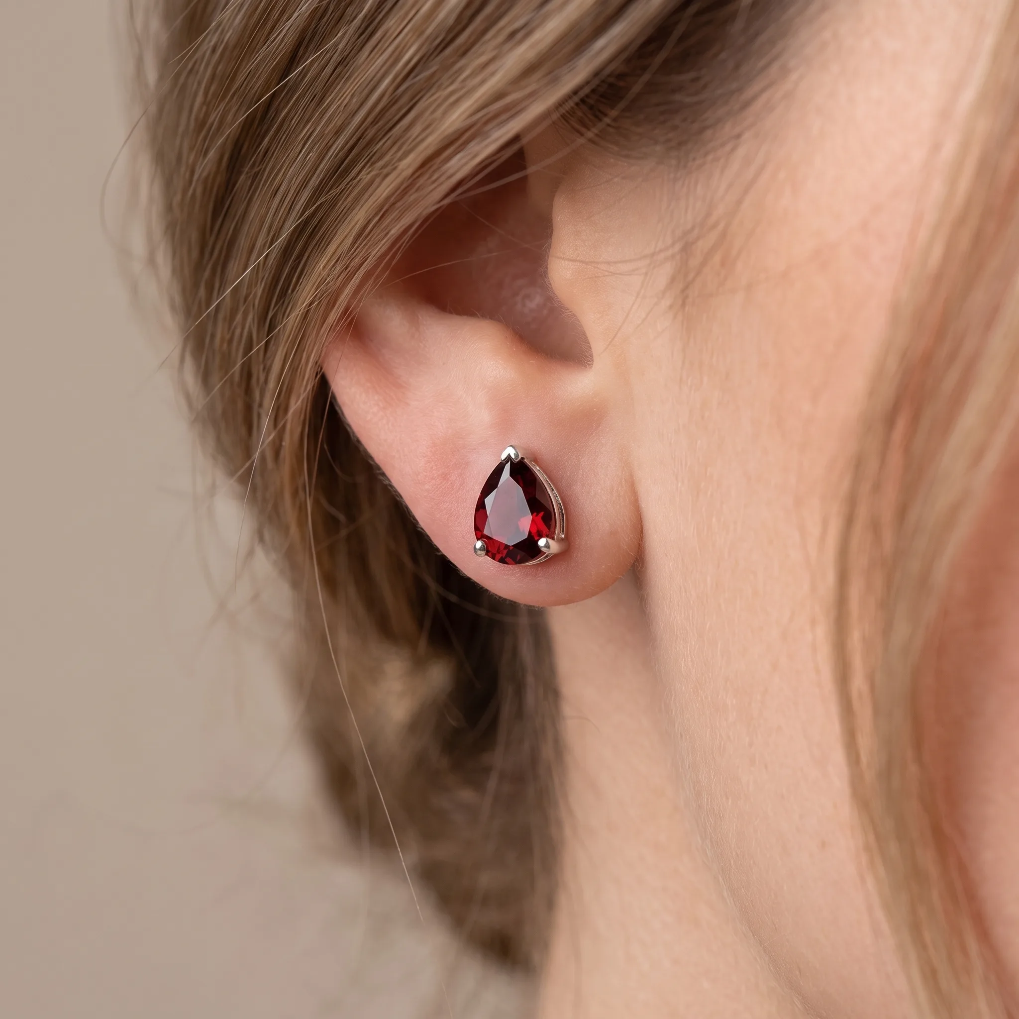 Product image of Garnet Pear Cut Silver Stud Earrings