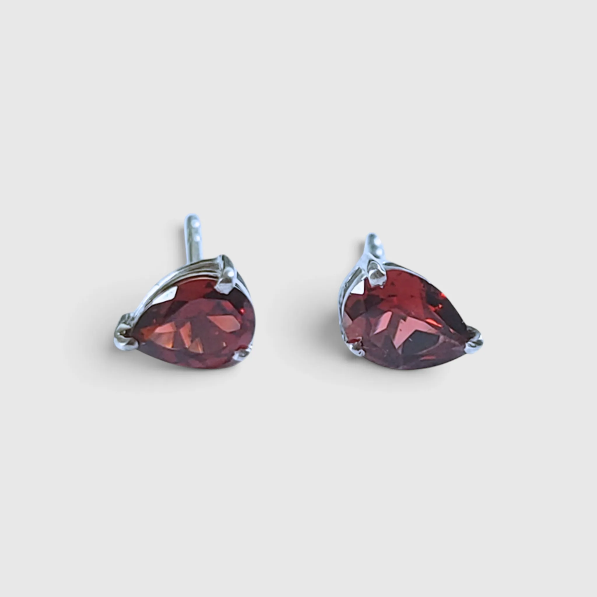 Product image of Garnet Pear Cut Silver Stud Earrings