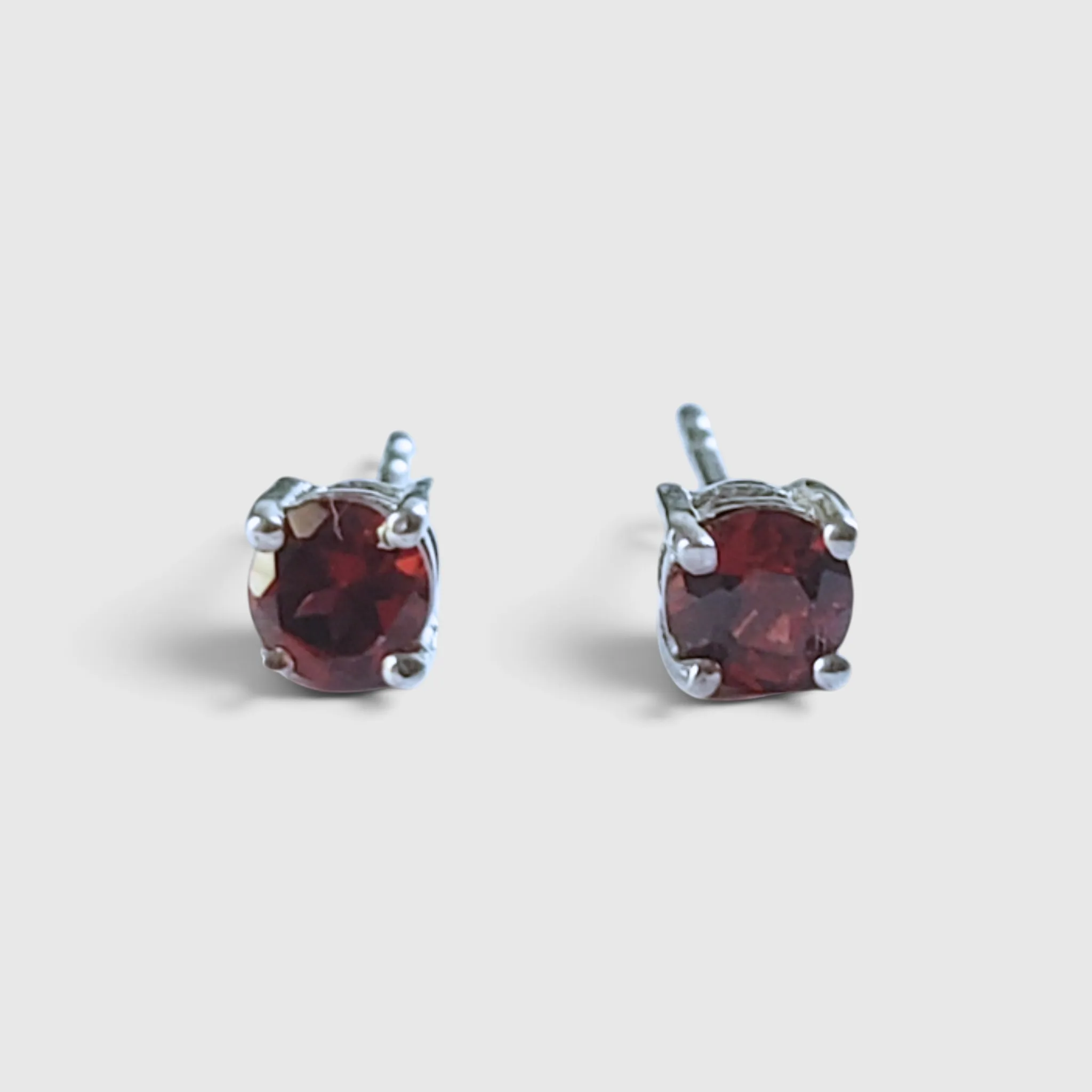 Product image of Garnet Round Faceted Silver Stud Earrings